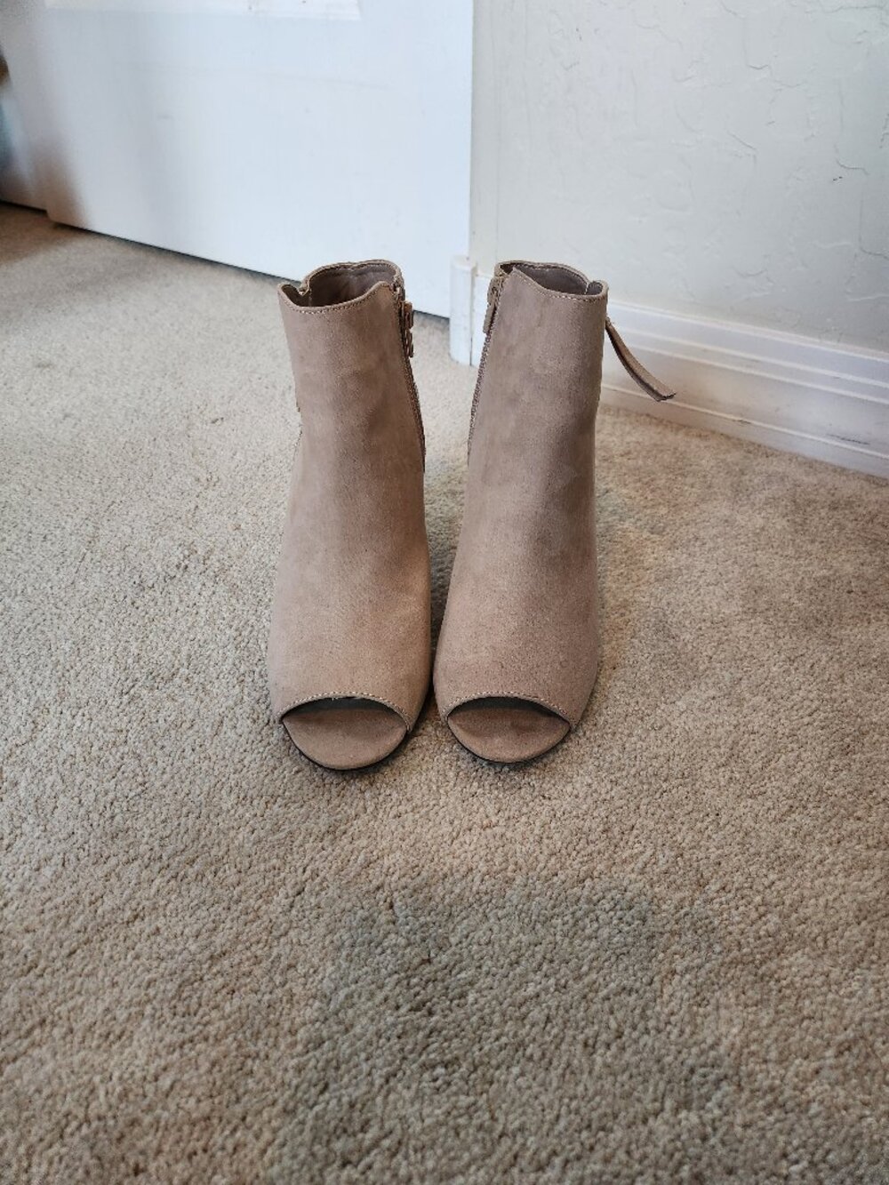 Embroidered, pink ankle booties.